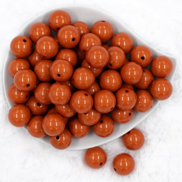 top view of a pile of 20mm Burnt Orange Solid Bubblegum Beads