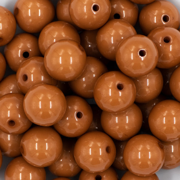 close up view of a pile of 20mm Caramel Brown Solid Bubblegum Beads