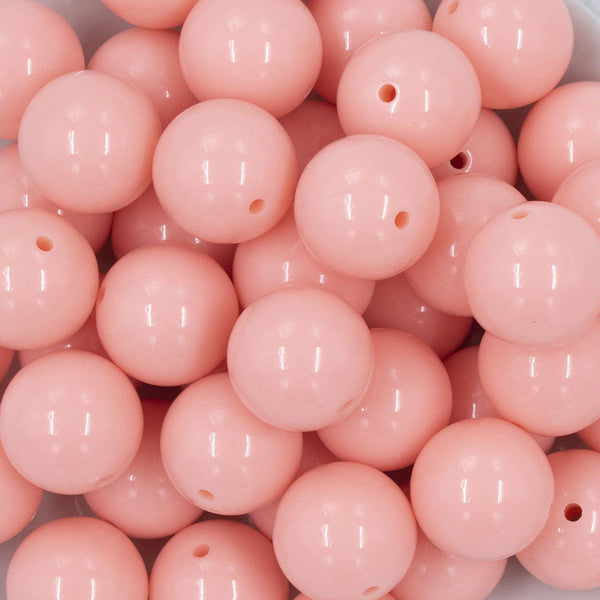 Close up view of a pile of 20mm Carnation Pink Solid Acrylic Chunky Bubblegum Beads
