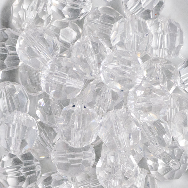 Close up view of a pile of 20mm Clear Transparent Faceted Bubblegum Beads