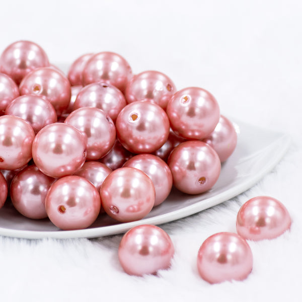front view of a stack of 20mm Coral Pink Faux Pearl Acrylic Bubblegum Beads