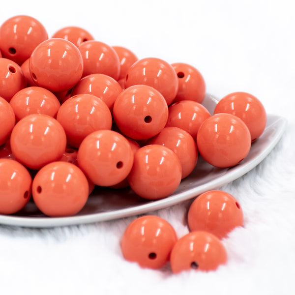 front view of 20mm Coral Orange Bubblegum Beads on white background