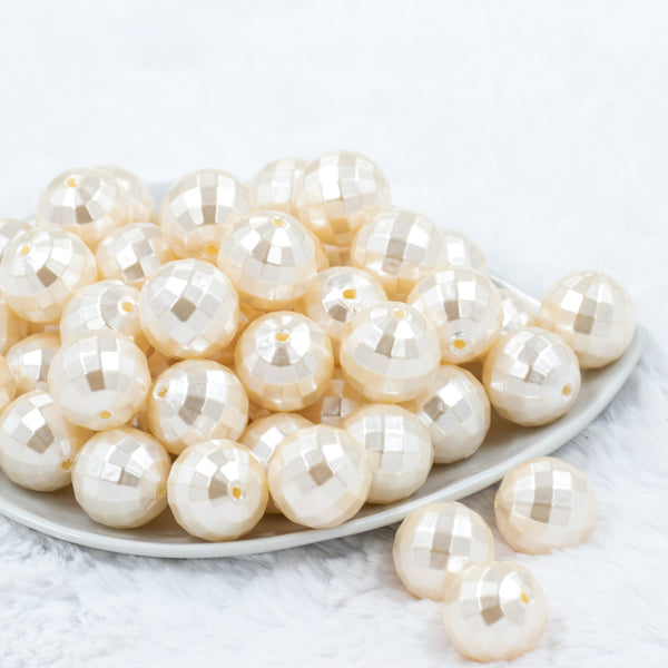 front view of a pile of 20mm Ivory / Cream Disco Faceted Pearl Chunky Bubblegum Beads