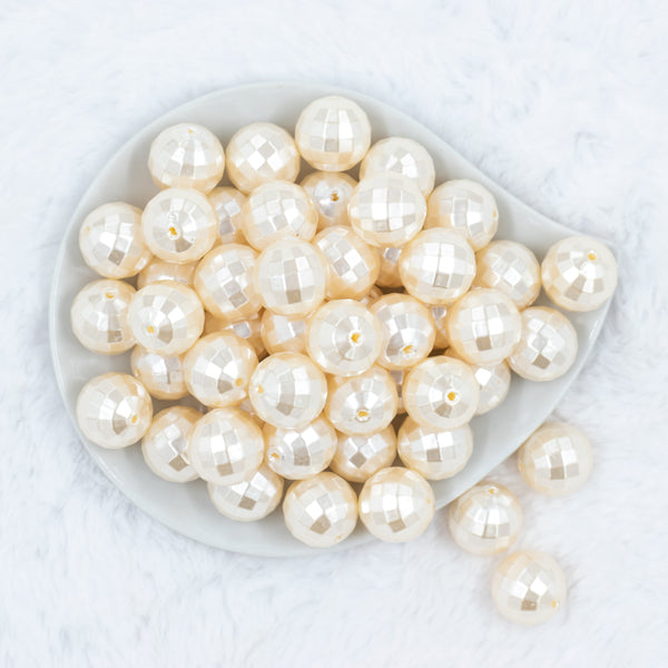 top view of a pile of 20mm Ivory / Cream Disco Faceted Pearl Chunky Bubblegum Beads