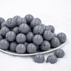 front view of a pile of 20mm Dark Gray Solid Bubblegum Beads