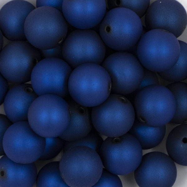 Close up view of a pile of 20mm Deep Blue Matte 
