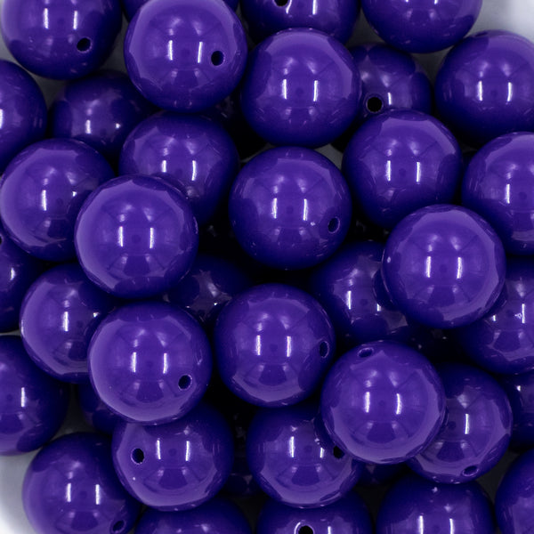 close up view of a pile of 20mm Deep Purple Solid Bubblegum Beads