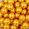 Close up view of a pile of 20mm Golden Yellow Faux Pearl Chunky Acrylic Bubblegum Beads