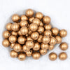 Top view of a pile of 20mm Gold Faux Pearl Chunky Acrylic Bubblegum Beads