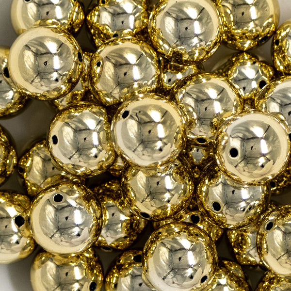 Close up view of a pile of 20mm Reflective Gold Acrylic Bubblegum Beads