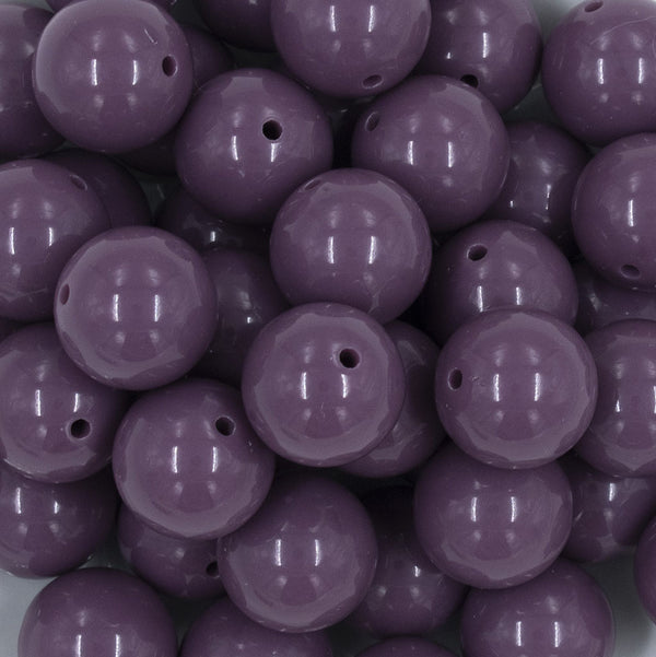 Close up view of a pile of 20mm Grape Purple Solid Acrylic Chunky Bubblegum Beads
