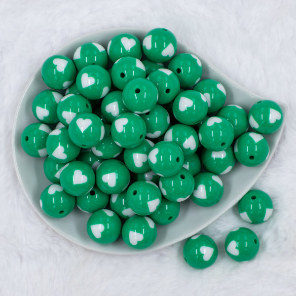 top view of a pile of 20mm Green with White Hearts Chunky Acrylic Bubblegum Beads