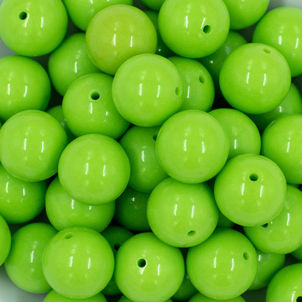 close up view of a pile of 20mm Neon Lime Solid Bubblegum Beads