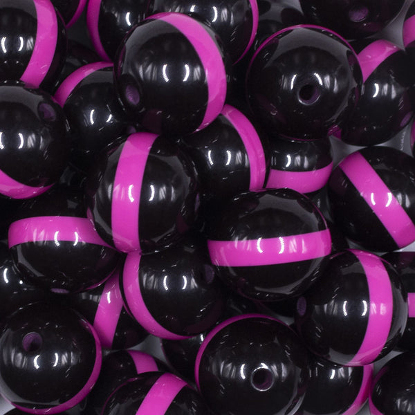 close up view of a pile of 20mm Hot Pink Band on Black Bubblegum Beads