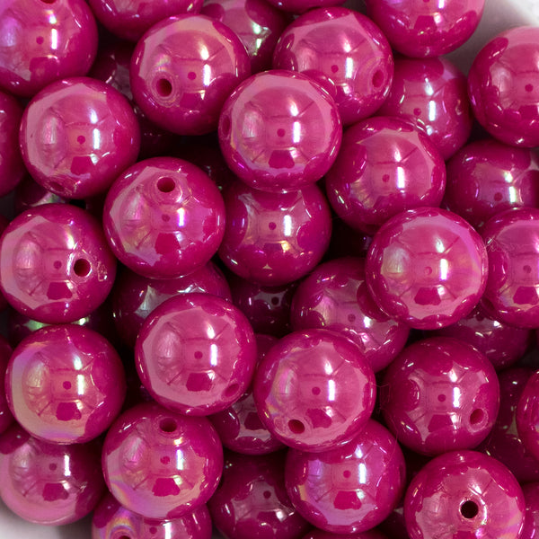 Close up view of a pile of 20mm Hot Pink Solid AB Bubblegum Beads
