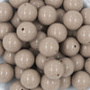 Close up view of a pile of 20mm Latte Brown Solid Chunky Acrylic Bubblegum Beads