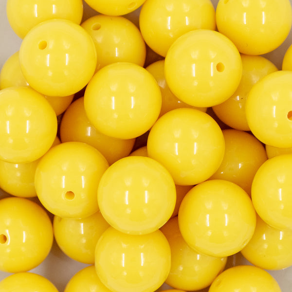 close up of a pile of 20mm Lemon Yellow Solid Bubblegum Beads