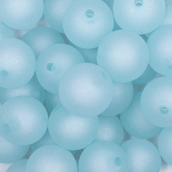 close up view of a pile of front view of a pile of 20mm light blue Frosted Bubblegum Beads