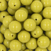 Close up view of a pile of 20mm Lima Green Solid Acrylic Chunky Bubblegum Beads