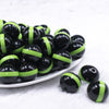 front view of a pile of 20mm Lime Green Band on Black Bubblegum Beads