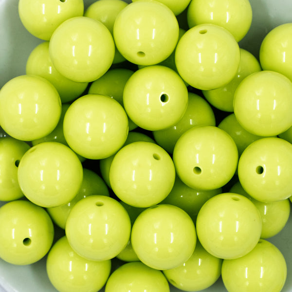 close-up view of a pile of 20mm Chartreuse Yellow Solid Bubblegum Beads