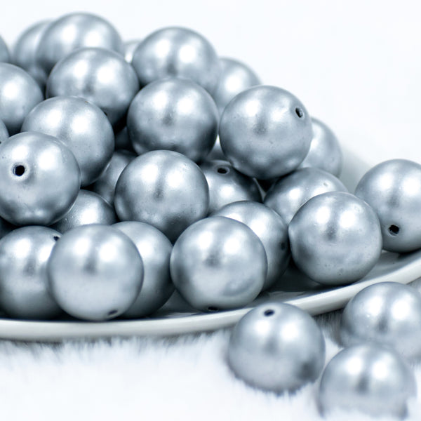 front of a pile of 20mm Matte Solid Silver Bubblegum Beads