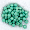 Top view of a pile of 20mm Mint Green with Gold Arrows Print Chunky Bubblegum Beads