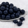 front of a pile of 20mm Navy Blue Solid Bubblegum Beads