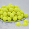 Front view of a pile of 20mm Neon Yellow Solid Chunky Acrylic Bubblegum Beads