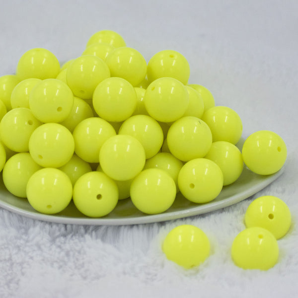 Front view of a pile of 20mm Neon Yellow Solid Chunky Acrylic Bubblegum Beads