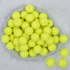 Top view of a pile of 20mm Neon Yellow Solid Chunky Acrylic Bubblegum Beads