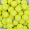 Close up view of a pile of 20mm Neon Yellow Solid Chunky Acrylic Bubblegum Beads