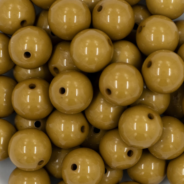 Close up view of a pile of 20mm Olive Green Solid Bubblegum Beads