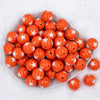 top view of a pile of 20mm Orange with White Stars Bubblegum Bead