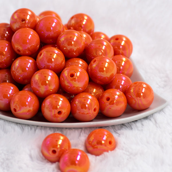 Front view of a pile of 20mm Orange Solid AB Bubblegum Beads