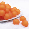 front view of a pile of 20mm Orange Frosted Bubblegum Beads