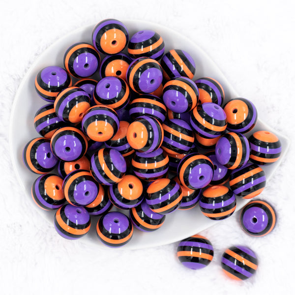 top view of a pile of 20mm Orange, Purple & Black Stripe Bubblegum Beads