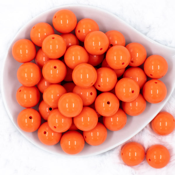 top of a pile of 20mm Orange Solid Bubblegum Beads