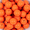 close up of a pile of 20mm Orange Solid Bubblegum Beads