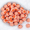 top view of a pile of 20mm Orange with White Stripes Bubblegum Bead