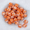 top of a pile of 20mm Orange Tablet Bubblegum Beads