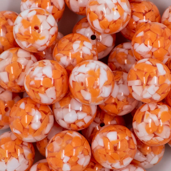 close up of a pile of 20mm Orange Tablet Bubblegum Beads