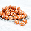 front view of a pile of 20mm Peach with White Polka Dots Bubblegum Beads