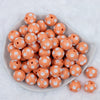 top view of a pile of 20mm Peach with White Polka Dots Bubblegum Beads