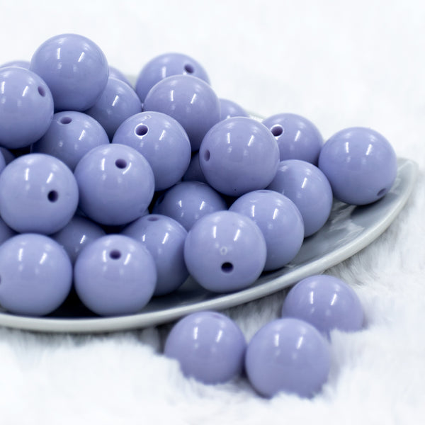 front view of a pile of 20mm Periwinkle Purple Solid Bubblegum Beads