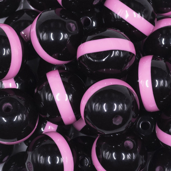 close up view of a pile of 20mm Pink Band on Black Bubblegum Beads