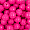 close up view of a pile of 20mm Hubba Bubba Pink Solid Bubblegum Beads