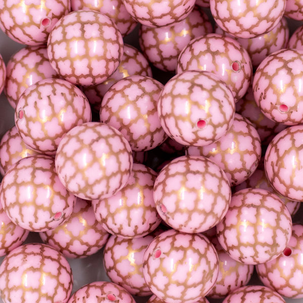 close-up view of a pile of 20mm Pink with Gold Quarterfoil Print Bubblegum Beads