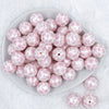 Top view of a pile of 20mm Pink Snowflake Print on White Acrylic Bubblegum Beads