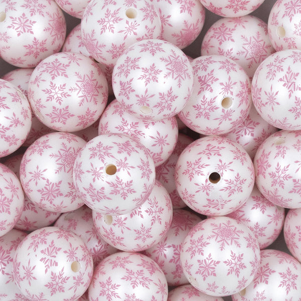 Close up view of a pile of 20mm Pink Snowflake Print on White Acrylic Bubblegum Beads
